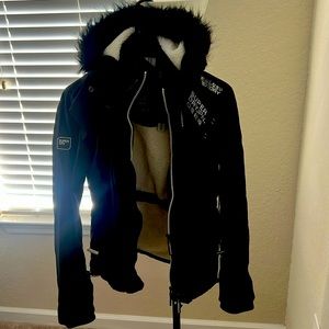 Size x small super dry coat black with white trim